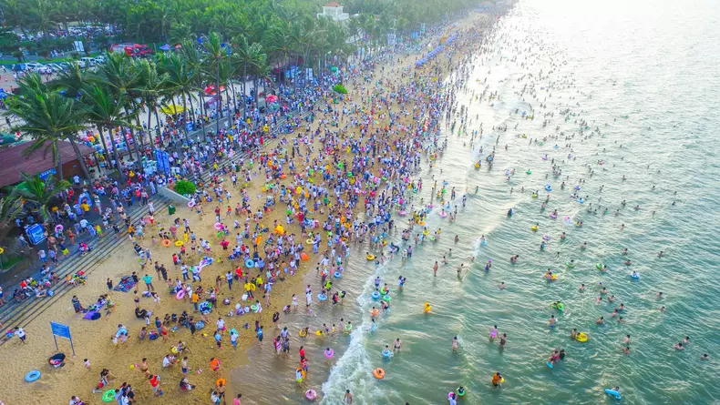 People Crowd At Beach In Haikou