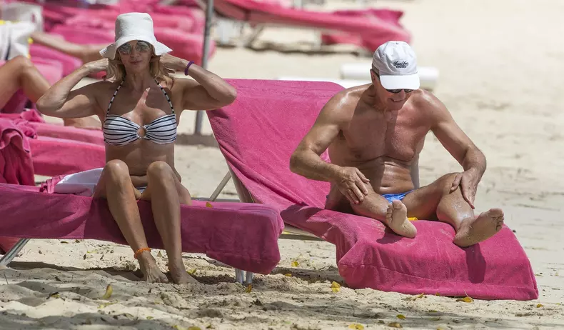 Retired Scottish footballer Graeme Souness and his wife Karen relax on the beach in Barbados