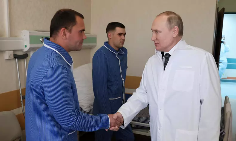 Russian President Putin visits a military hospital