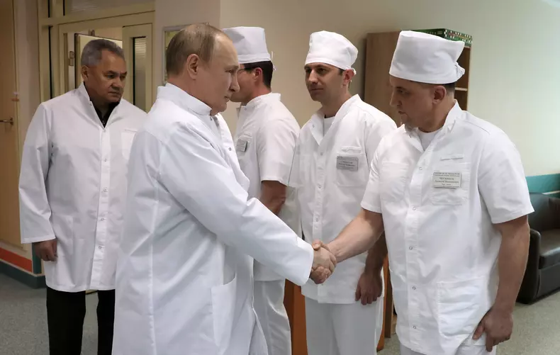 Russian President Putin visits a military hospital