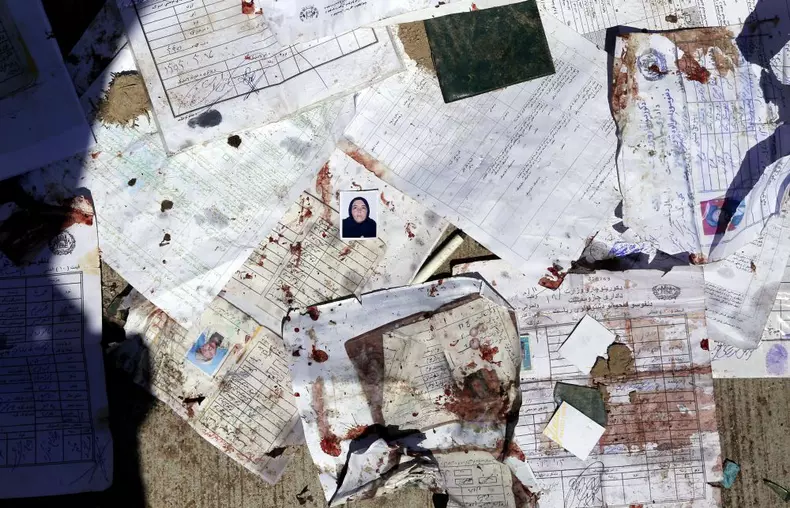 At least nine killed and dozens in suicide bomb attack at voter registration center in Kabul
