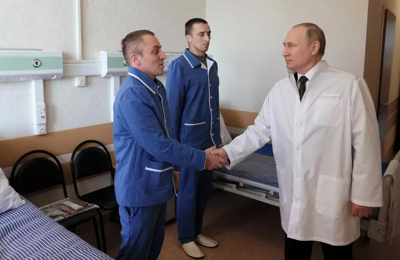 Russian President Putin visits a military hospital