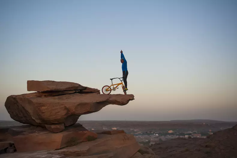 Clifftop BMX Yoga: Extreme 68-year-old Performs On Bike 300ft Above Ground