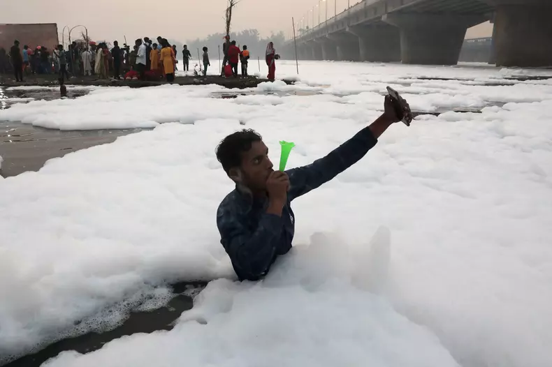 Chhath Puja celebration in Polluted Yamuna River in Uttar Pradesh