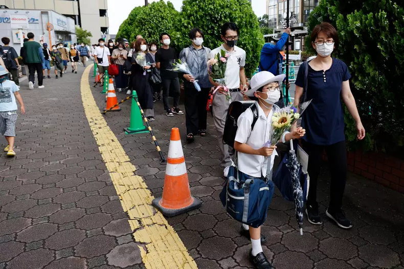 People in Nara bring flowers a day after the murder of former PM Shinzo Abe