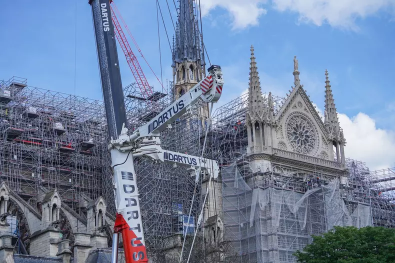 Paris, France. 7  May, 2024. Large parts of Notre Dame catheredral covered in scaffolding as the restoration continues but will not be completed in time for the  Paris Olympics. A structural fire in April 2019 caused serious damage and forced the cathedra