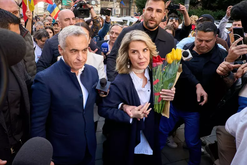 Bucharest, Romania. 7th Mar, 2025: Far-right ultranationalist Calin Georgescu, candidate for the 2025 Romanian presidential elections, and his wife Cristela leave after submitting his candidacy at the Central Electoral Bureau. Georgescu is under judicial