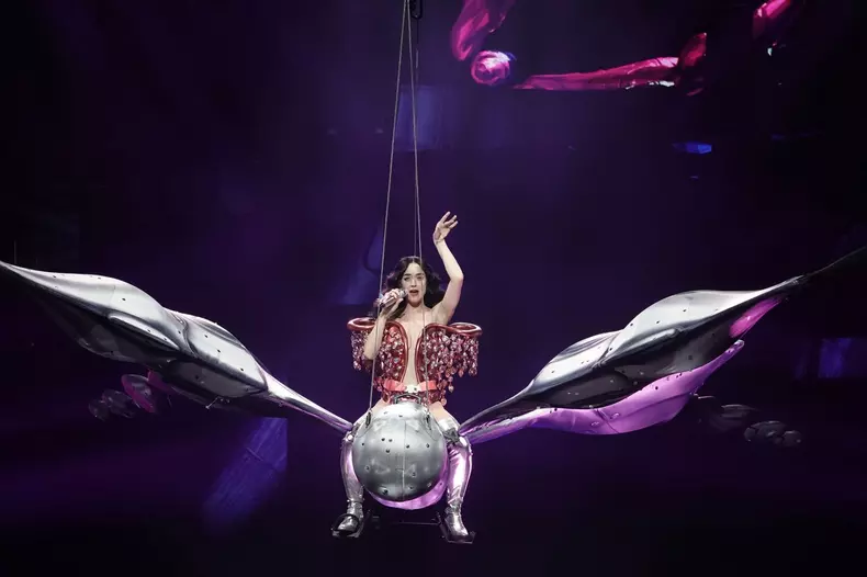Singer Katy Perry is seen floating on a large butterfly above the stage in Las Vegas