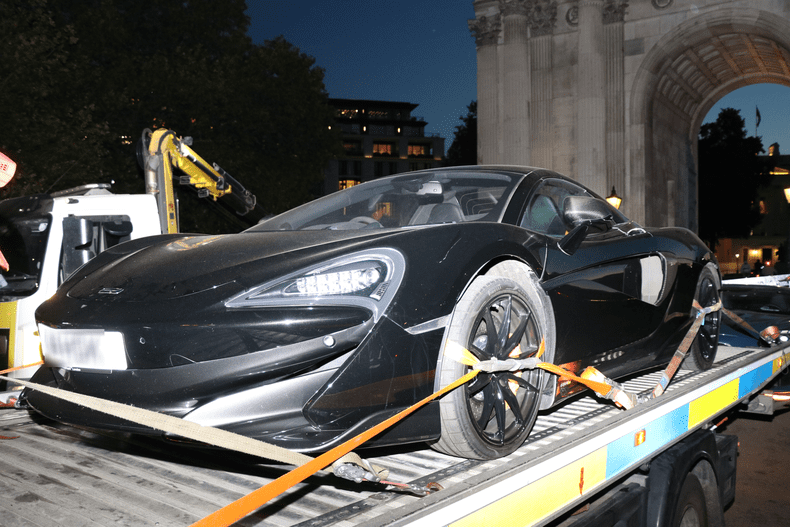 Seized_McLaren_being_removed_from_Wellington_Arch_front_JPG
