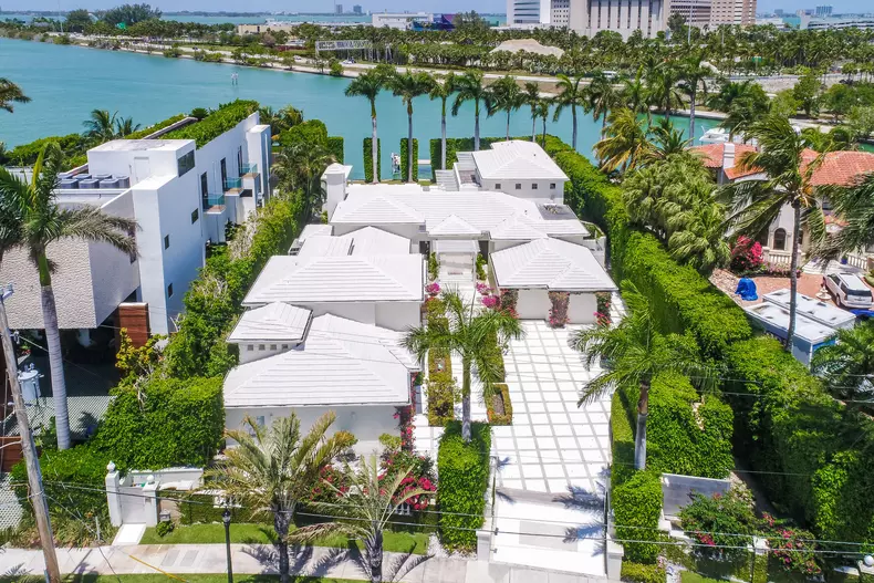 Grammy-award winning singer Shakira and her partner Barcelona star Gerald Pique have put their Miami Beach estate up for sale for $11.6 million.