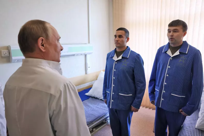 Russian President Putin visits a military hospital
