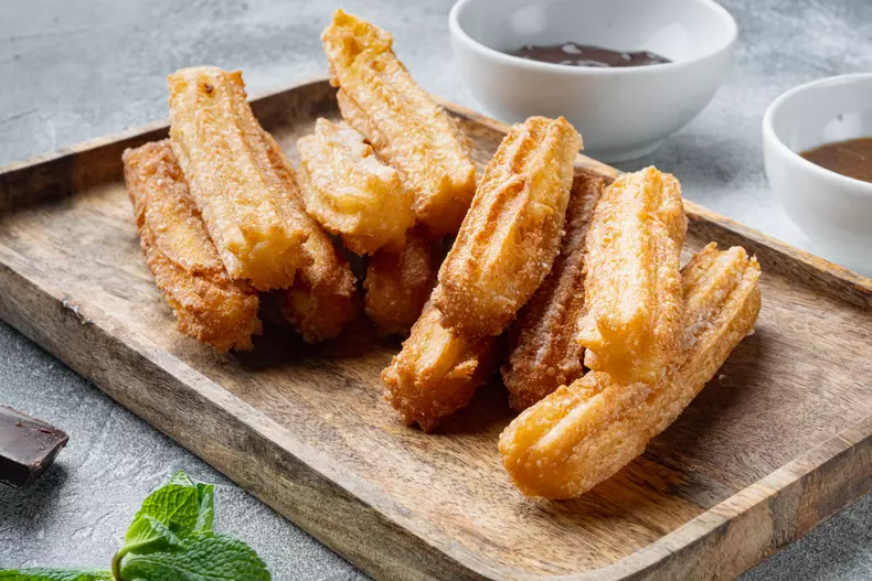 Churros,Sprinkled,With,Powdered,Sugar,Set,,On,Gray,Background