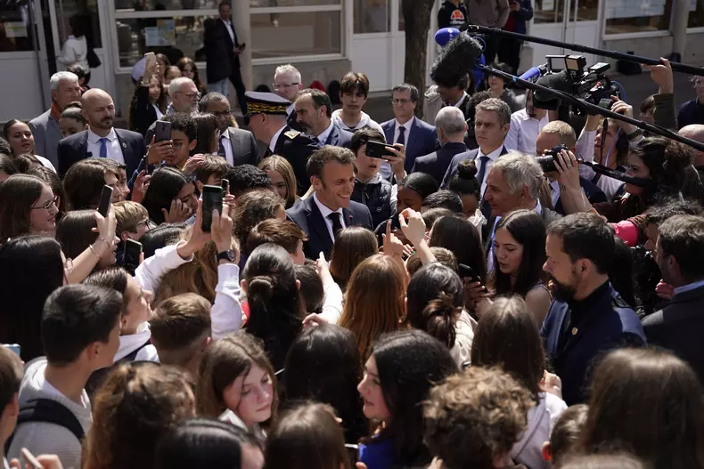 French President Emmanuel Macron visits a middle school in Ganges