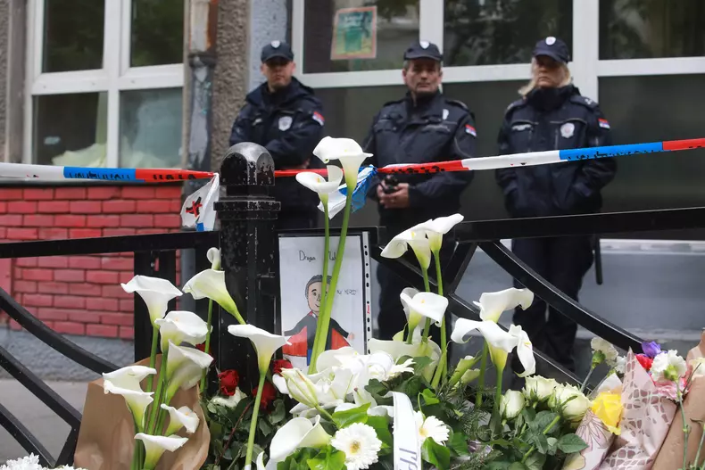 Thousands gather to pay tribute to victims of school shooting in Serbia