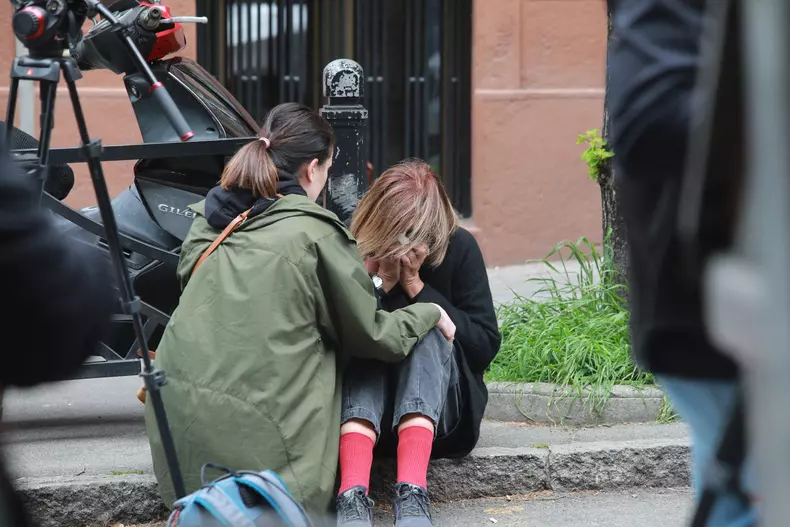 Thousands gather to pay tribute to victims of school shooting in Serbia