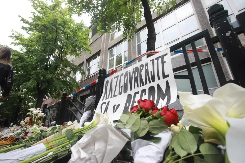 Thousands gather to pay tribute to victims of school shooting in Serbia
