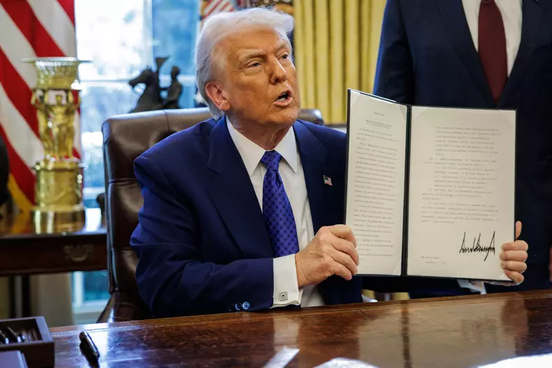 DC: U.S. President Trump Signs Executive Orders in the Oval Office