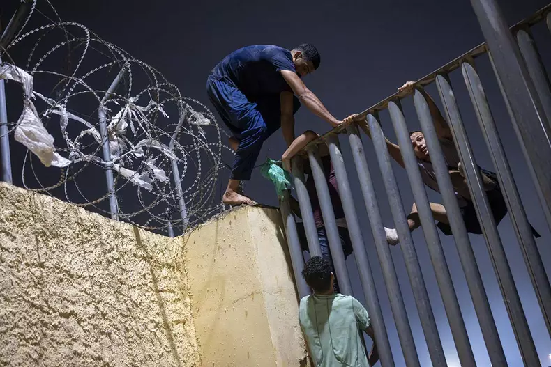 AFP__202607311__AA_31072026_2901020__v1__HighRes__HundredsOfMigrantsReachSpainSCeutaA
