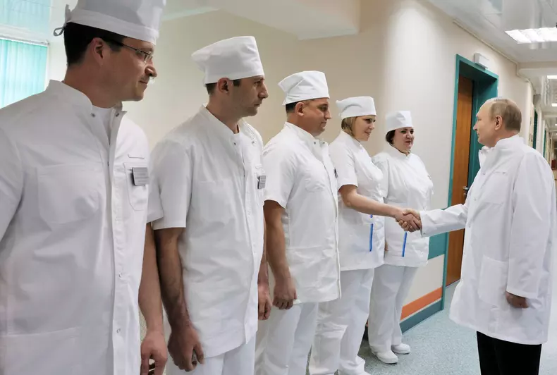 Russian President Putin visits a military hospital