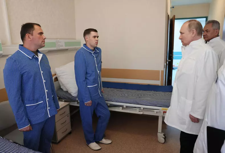 Russian President Putin visits a military hospital