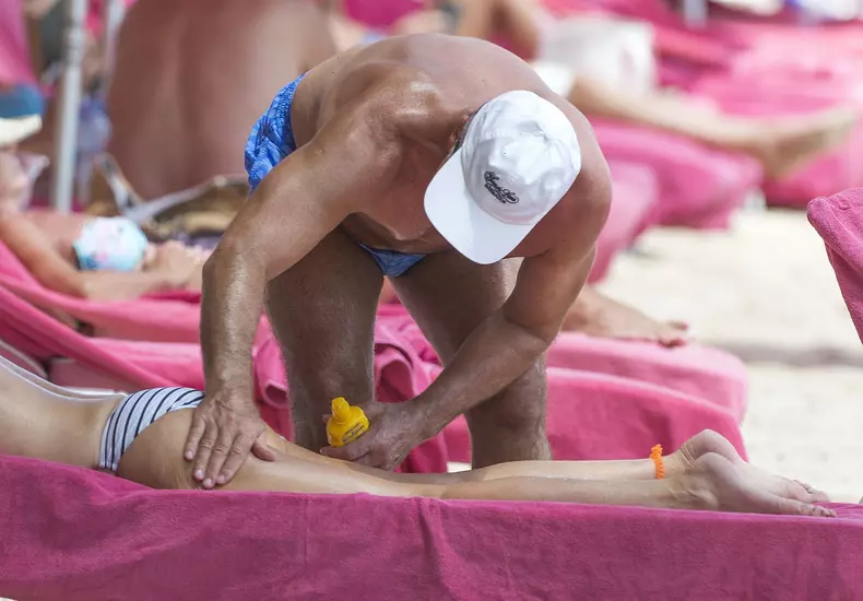 Retired Scottish footballer Graeme Souness and his wife Karen relax on the beach in Barbados