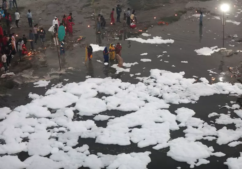 Chhath Puja celebration in Polluted Yamuna River in Uttar Pradesh