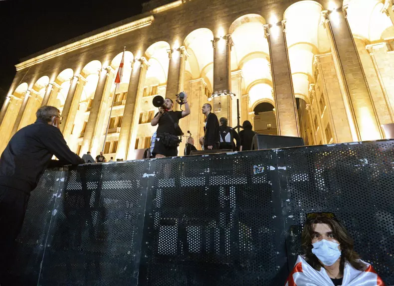 Participants of a protest against the adoption of the law on foreign agents near the Georgian Parliament building during a clash with the police.