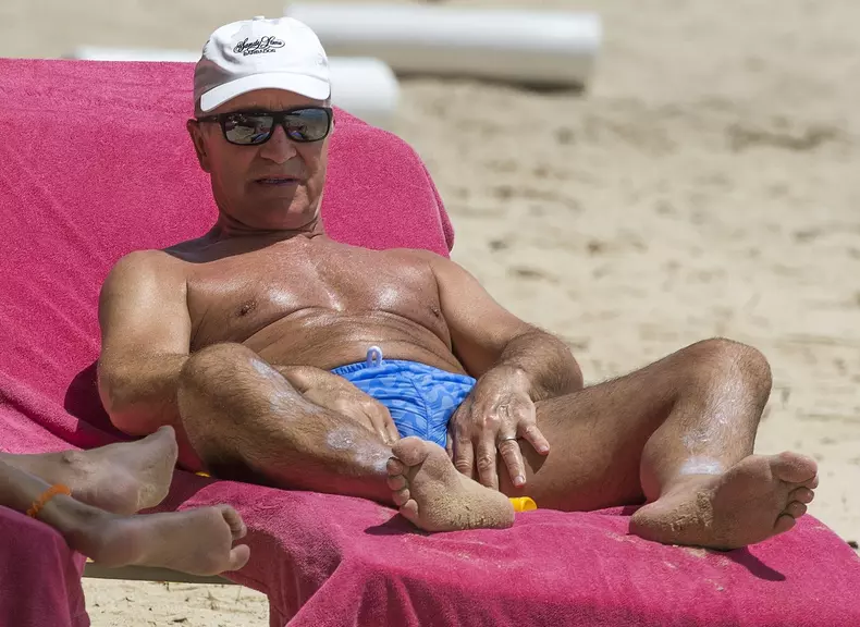 Retired Scottish footballer Graeme Souness and his wife Karen relax on the beach in Barbados