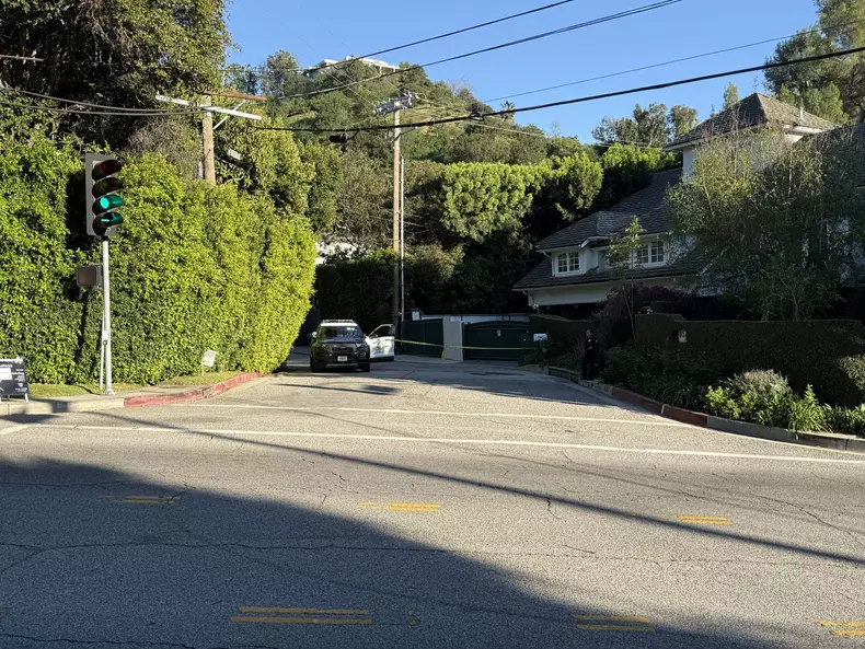 Police shut down the road outside of Rihanna's Beverly Crest home as it was stuck by gunshots Sunday afternoon,