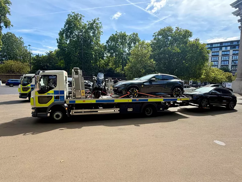 A Ferrari Purosangue being removed from Wellington Arch