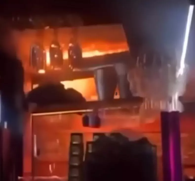Crans-Montana: Flames engulfing the city and people fleeing after a deadly explosion during a New Year's Eve celebration.