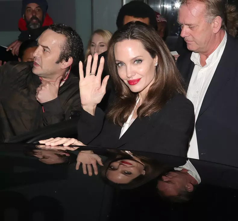 Angelina Jolie greets her fans on her way out from BFI