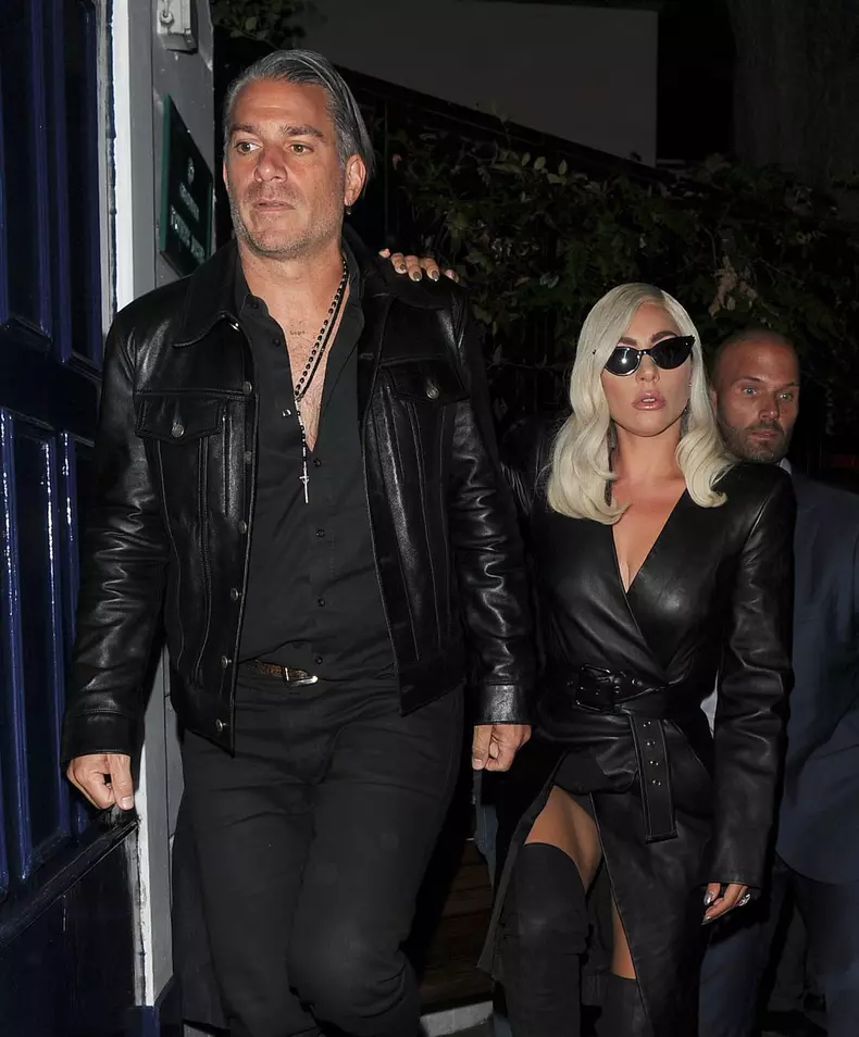 Lady Gaga leaves her hotel, in an all black leather outfit to attend a private screening of her new movie 'A Star Is Born', before heading to a pub in Knightsbridge with her boyfriend Christian Carino.