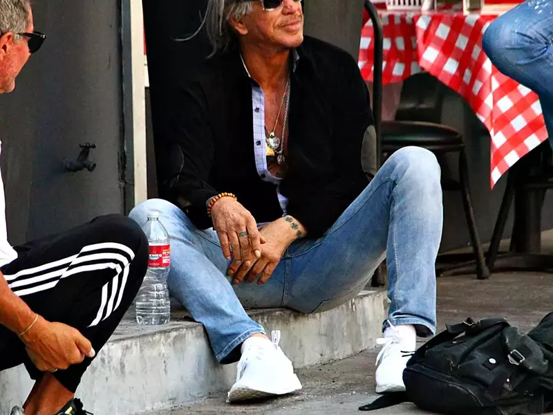 Mickey Rourke Seen Sitting On Sidewalk Talking to Pals