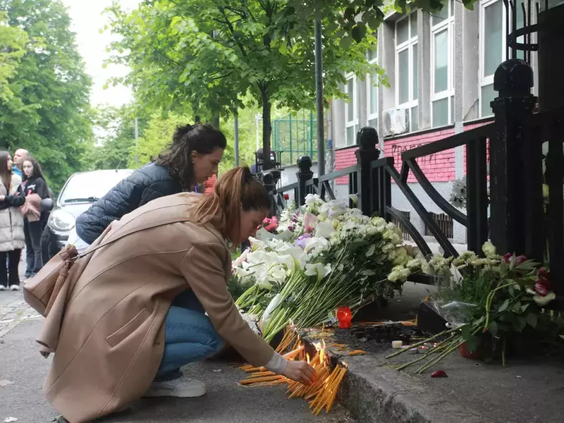 Thousands gather to pay tribute to victims of school shooting in Serbia