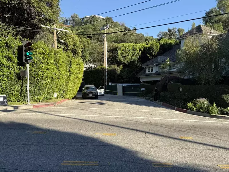 Police shut down the road outside of Rihanna's Beverly Crest home as it was stuck by gunshots Sunday afternoon, , A Woman in her 30's has been arrested after allegedly firing shots at Rihanna's Beverly Crest home, reportedly the suspect fired between seven and nine rounds from an AR-15-style rifle. Four of the rounds struck the house. 08 Mar 2026 Pictured: Police block of the street at Rihanna house after her home was struck by gun fire.,Image: 1081265051, License: Rights-managed, Restrictions: World Rights, Model Release: no