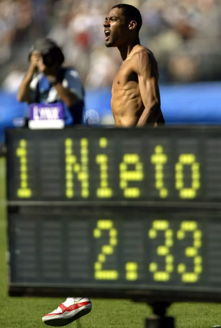 epa000235289 Jamie Nieto from Chula Vista, California, celebrates after clearing 2.33m in the men's high jump final at the U.S. Olympic Track and Field Trials in Sacramento, California, Sunday, 18 July 2004. Nieto won the event with the 2.33m jump. EPA/MIKE FIALA