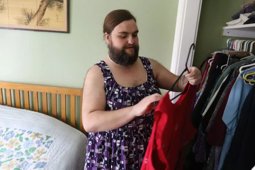 ***STRICT ONLINE EMBARGO UNTIL 00.01AM GMT THURSDAY 9TH JUNE 2016*** *** EXCLUSIVE - VIDEO AVAILABLE *** SPRINGFIELD, ORE - January 03: Jennifer Rose Geil selects outfit to wear from her closet on January 3, 2015 in Springfield, Oregon. A woman with excess facial hair has ditched her razors and grown a full beard  and claims shes never felt sexier. Rose Geil, 39, first noticed her excess hair when she was just 13 and started shaving immediately. The devastated teenager, from Oregon, America, quickly realised she would have to shave every day to keep the stubble at bay. But after years of shaving, plucking and expensive laser removal procedures, Rose has now decided to accept her whiskers  and couldnt be happier. PHOTOGRAPH BY Michael Sullivan / Barcroft Images London-T:+44 207 033 1031 E:hello@barcroftmedia.com - New York-T:+1 212 796 2458 E:hello@barcroftusa.com - New Delhi-T:+91 11 4053 2429 E:hello@barcroftindia.com www.barcroftimages.com *** Local Caption *** 02419817
