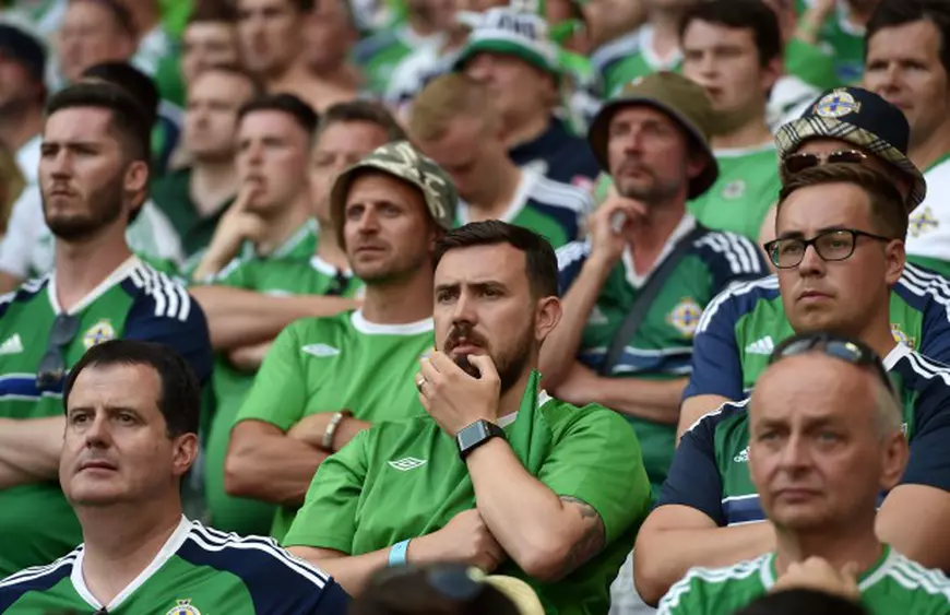 epa05359825 Supporters of Northern Ireland during the UEFA EURO 2016 group C preliminary round match between Poland and Northern Ireland at Stade de Nice in Nice, France, 12 June 2016. (RESTRICTIONS APPLY: For editorial news reporting purposes only. Not used for commercial or marketing purposes without prior written approval of UEFA. Images must appear as still images and must not emulate match action video footage. Photographs published in online publications (whether via the Internet or otherwise) shall have an interval of at least 20 seconds between the posting.) EPA/PETER POWELL EDITORIAL USE ONLY