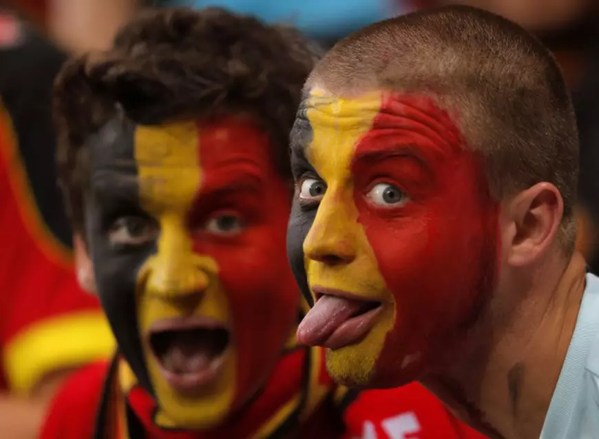 epa05362515 Belgian supporters before the UEFA EURO 2016 group E preliminary round match between Belgium and Italy at Stade de Lyon in Lyon, France, 13 June 2016. (RESTRICTIONS APPLY: For editorial news reporting purposes only. Not used for commercial or marketing purposes without prior written approval of UEFA. Images must appear as still images and must not emulate match action video footage. Photographs published in online publications (whether via the Internet or otherwise) shall have an interval of at least 20 seconds between the posting.) EPA/YURI KOCHETKOV EDITORIAL USE ONLY