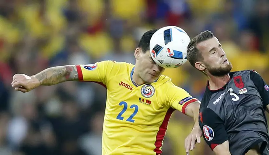 epaselect epa05377927 Cristian Sapunaru (L) of Romania in action against Ermir Lenjani of Albania during the UEFA EURO 2016 group A preliminary round match between Romania and Albania at Stade de Lyon in Lyon, France, 19 June 2016. (RESTRICTIONS APPLY: For editorial news reporting purposes only. Not used for commercial or marketing purposes without prior written approval of UEFA. Images must appear as still images and must not emulate match action video footage. Photographs published in online publications (whether via the Internet or otherwise) shall have an interval of at least 20 seconds between the posting.) EPA/YURI KOCHETKOV EDITORIAL USE ONLY