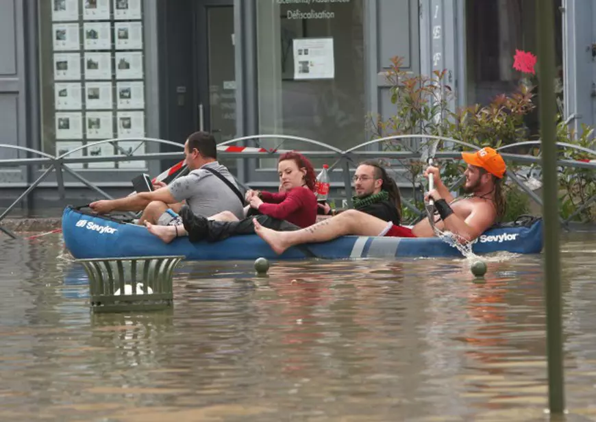 PARIS, FRANCE - JUNE 01 : Residents wade through a flooded street in Nemours, southeast of Paris, on June 1, 2016. Torrential rain has continued to lash northern and centra France. Mustafa Sevgi / Anadolu Agency