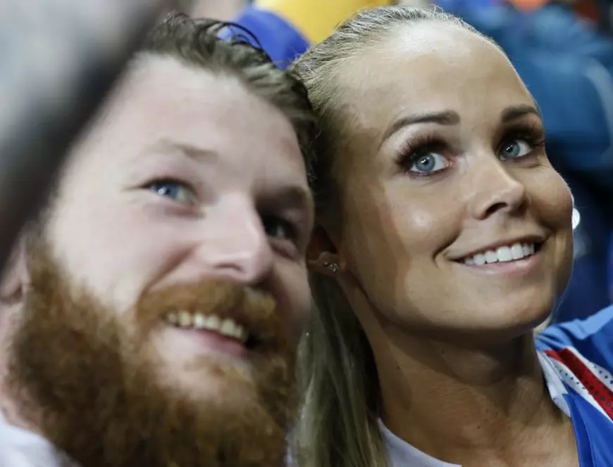 epa05406436 Aron Gunnarsson (L) of Iceland and his partner Kristbjoerg Jonasdottir at the end of the UEFA EURO 2016 quarter final match between France and Iceland at Stade de France in Saint-Denis, France, 03 July 2016. Iceland lost the match 2-5. (RESTRICTIONS APPLY: For editorial news reporting purposes only. Not used for commercial or marketing purposes without prior written approval of UEFA. Images must appear as still images and must not emulate match action video footage. Photographs published in online publications (whether via the Internet or otherwise) shall have an interval of at least 20 seconds between the posting.) EPA/ETIENNE LAURENT EDITORIAL USE ONLY