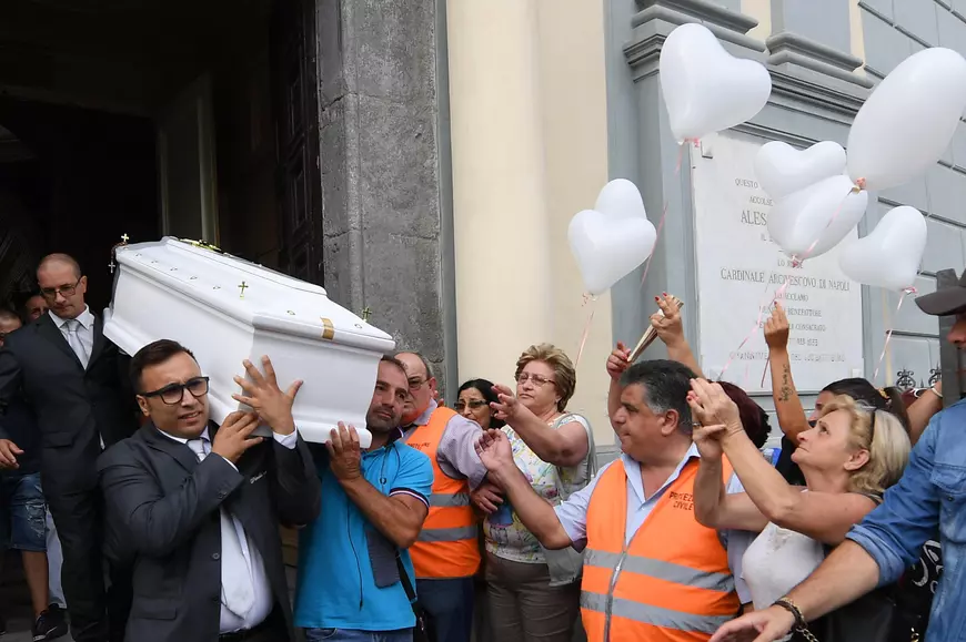epa05541986 A photo made available 16 September 2016 of the coffin of Tiziana Cantone being carried out of a church at the end of her funeral service in Casalnuovo, Naples, Italy, 15 September 2016. The 31-years-old woman had committed suicide after battling for months to have a viral video, showing her having sex, removed from the internet. The woman earlier had won a so-called 'Right to be forgotten' case but was ordered to pay the legal costs.  EPA/CIRO FUSCO