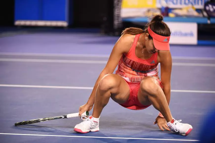 epa05114539 Ana Ivanovic of Serbia slips on court against to Anastasija Sevastova of Latvia during their second round match on day four of the Australian Open tennis tournament in Melbourne, Australia, 21 January 2016. EPA/JOE CASTRO AUSTRALIA AND NEW ZEALAND OUT