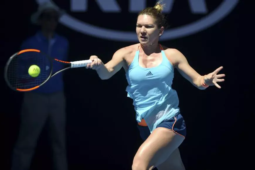 epa05720045 Simona Halep of Romania returns the ball to Shelby Rogers of the United States during their Women's Singles first round match of the Australian Open Grand Slam tennis tournament in Melbourne, Australia, 16 January 2017. The Australian Open tennis tournament runs from 16 to 29 January 2017. EPA/JOE CASTRO AUSTRALIA AND NEW ZEALAND OUT