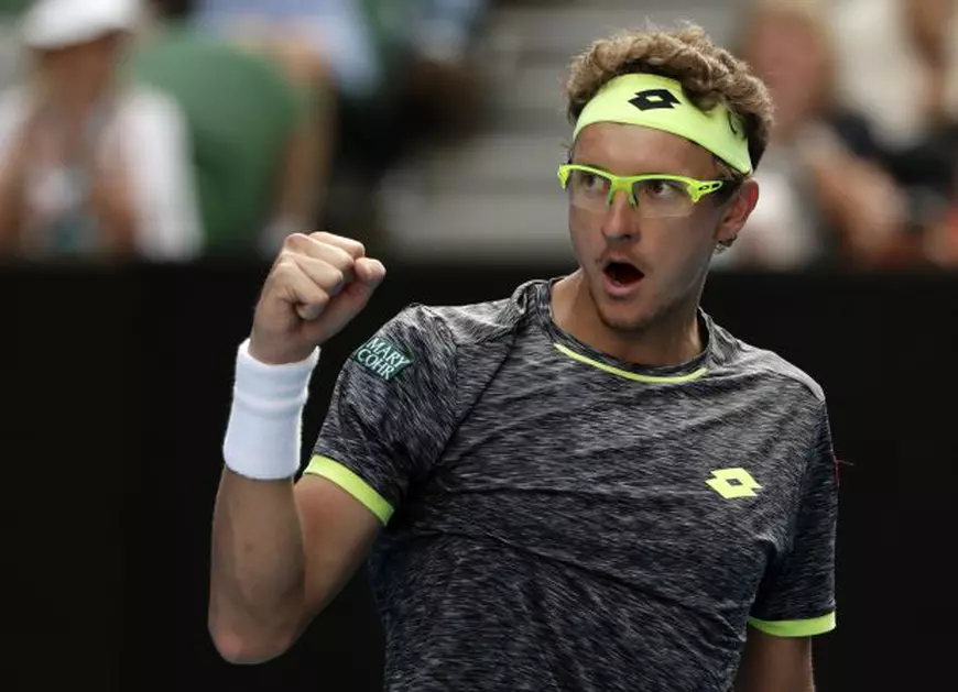 epa05729848 Denis Istomin of Uzbekistan reacts against Novak Djokovic of Serbia during round two of the Men?s Singles at the Australian Open Grand Slam tennis tournament in Melbourne, Victoria, Australia, 19 January 2017. EPA/MARK R. CRISTINO