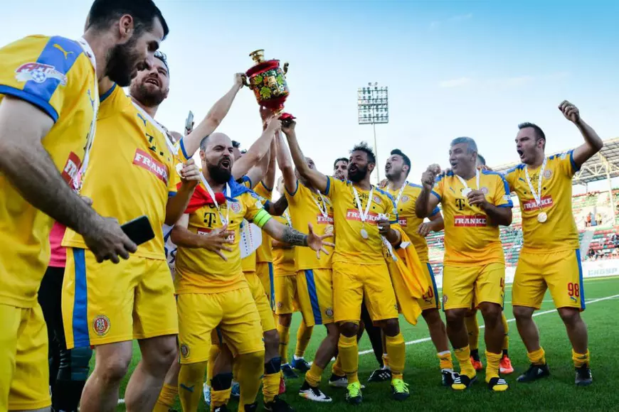 UPDATE Se joacă pe ”Ilie Oană” din Ploiești. Enache și Temișan dau piept cu Hagi și Gică Popescu pe Arena Națională.  Miuță de Centenar între artiști și fotbaliști